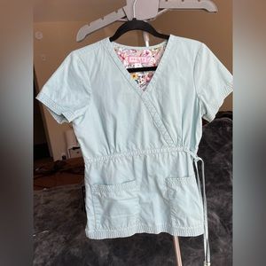 Koi mint colored scrub shirt with cinched waist tie